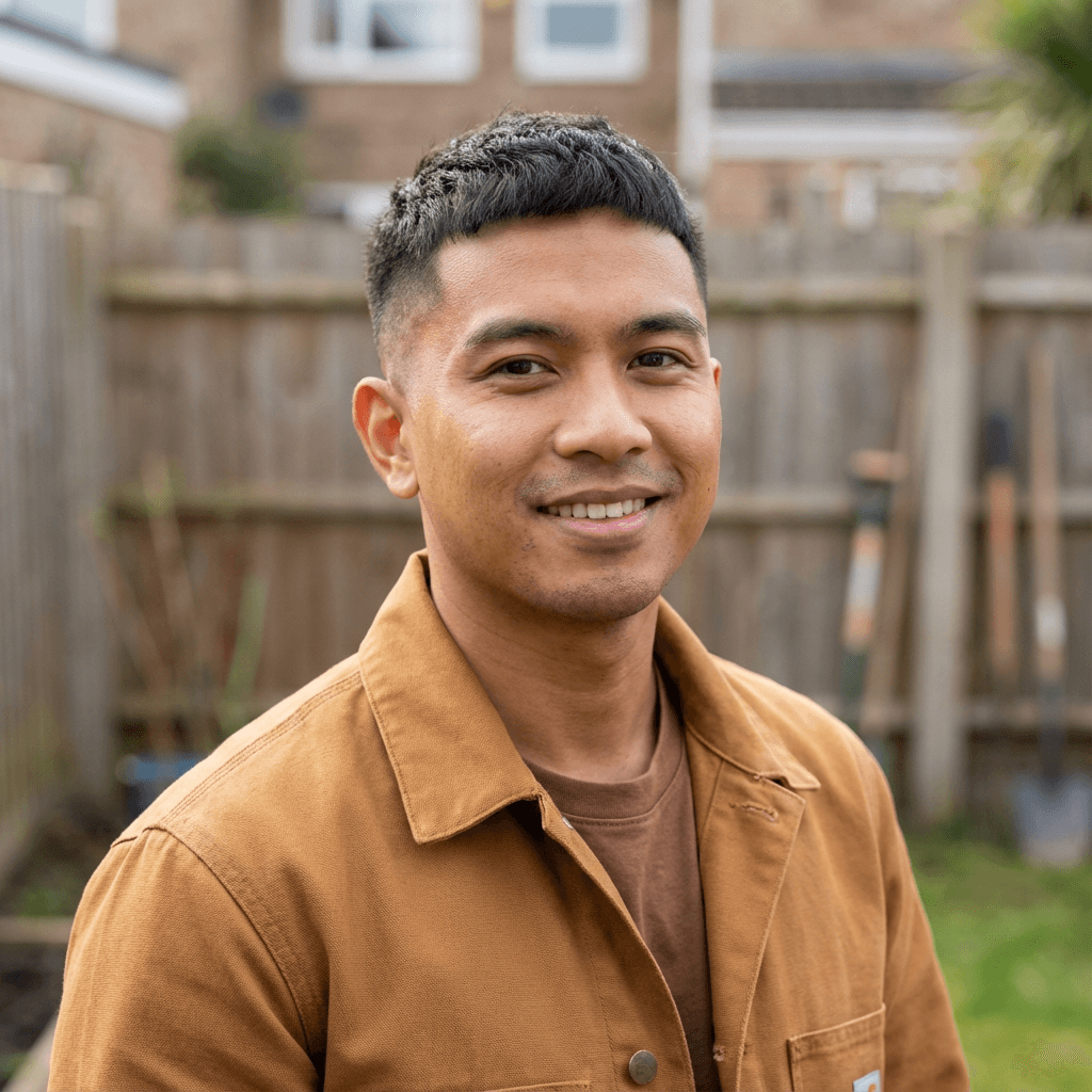 Michael Thompson smiling in front of his house